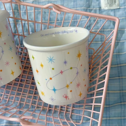 Colorful polka dot smiling face holding cup ceramic coffee cup