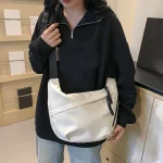 Neutral style tote bag with strap for carrying fitness items. New mini street-style handbag with shoulder strap. Lightweight and 6