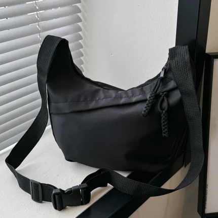 Neutral style tote bag with strap for carrying fitness items. New mini street-style handbag with shoulder strap. Lightweight and